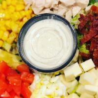 Cobb Salad · Gluten free. Romaine, turkey, bacon, swiss, avocado, corn, diced tomato hard boiled egg, ran...