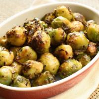 Roasted Bacon Brussel Sprouts · Brussel sprouts smothered with bacon crumbles and dried cranberries blended with spices.  Ba...