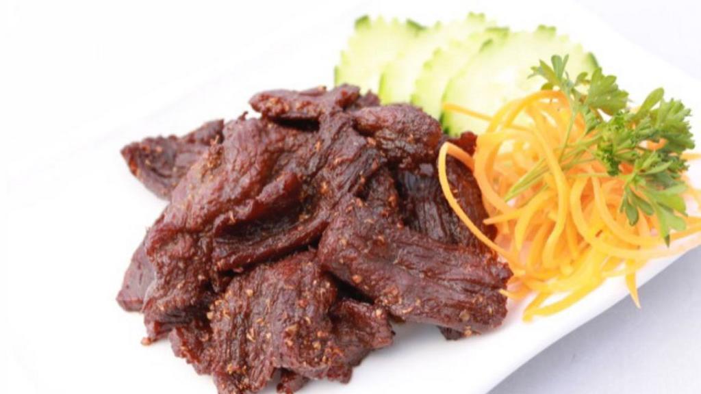 Heaven Beef · Thai style beef jerky marinated in coriander seed served with spicy sriracha.