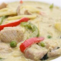 Green Curry · Green chili paste, bamboo shoots, green peas, bell peppers, fresh basil, and coconut milk.