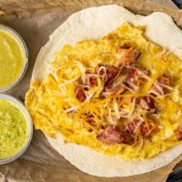 Sausage, Egg And Cheese · Comes in a 6 inch flour tortilla, scrambled eggs, sausage and topped it up with mix cheese.