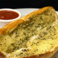 Garlic Bread · Our signature toasted garlic bread. Served with marinara sauce.