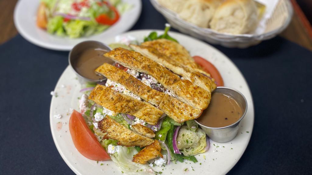 Greek Chicken Salad · A mix of greens with kalamata olives, onions, roasted red peppers, artichoke hearts, tomatoes. Topped with feta cheese, grilled chicken, & served with our homemade balsamic vinaigrette (served on the side).