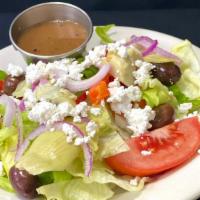 Greek Salad · A mix of greens with kalamata olives, onions, roasted red peppers, artichoke hearts, tomatoe...