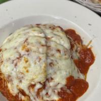 Veal Parmigiana
 · Lightly fried breaded veal, topped with marinara sauce & mozzarella cheese. Served with spag...