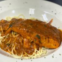 Salmon Oreganata
 · Broiled salmon sautéed in olive oil and shallots with plum tomato sauce. Served with pasta.