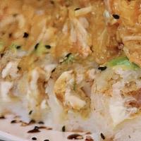 Skinny Roll · Shrimp tempura, kanikama, fish tempura, avocado, cream cheese, soy paper, topped with our te...
