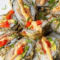 Plaza Roll · Salmon, tuna, white fish, avocado, tempura, topped with masago, scallions, spicy mayo, sesam...