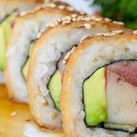 Chihuahua Roll · Crab, cucumber, avocado, tuna, breaded, sweet sauce and sesame seeds.