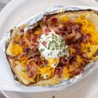 Baked Potato · With butter, cheese, sour cream, bacon, and chives.