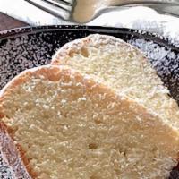 Million Dollar Dollar Pound Cake · This simple looking pound cake is packed with flavor.  It has a hint of almond and dusted wi...