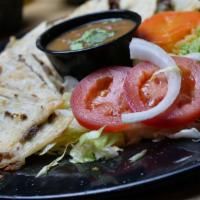 Quesadilla Plate · Beer or chicken quesadillas, served with guacamole, sour cream, rice, and beans.