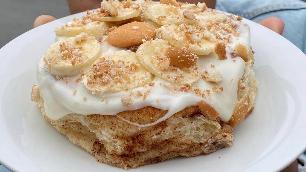 Banana Pudding · Enjoy A Homemade Classic Golden Brown Buttery, Sweet And Fluffy Sweet Roll. Topped With Granny's Secret Scrumptious Creamy, Smooth Banana Glaze. Topped with Fresh Slices Of Banana’s And Crushed Vanilla Cookies.