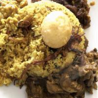 Yellow Rice · Pan Fried rice with cashews, onion, curry leaves, mustered seeds, raisins & other spices com...