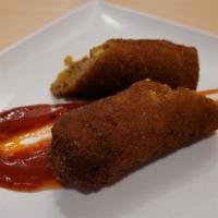 Mutton Roll · Wrapped in a home made pancake, filled & crumbed, deep fried