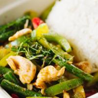 Pad Prik Khing · Spicy. Stir fried string beans, green peppers topped with kaffir lime leaves and curry.  Add...