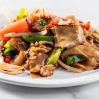 Pad Kee Mow · Stir fried flat noodle with your choice of meat, bell pepper, yellow onion, basil, tomatoes ...