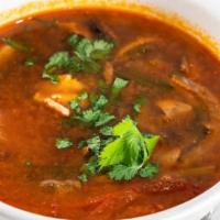 Tom Yum Gai Soup · Spicy chili paste soup with chicken served with galangal, lime leaves, lemongrass, mushroom ...
