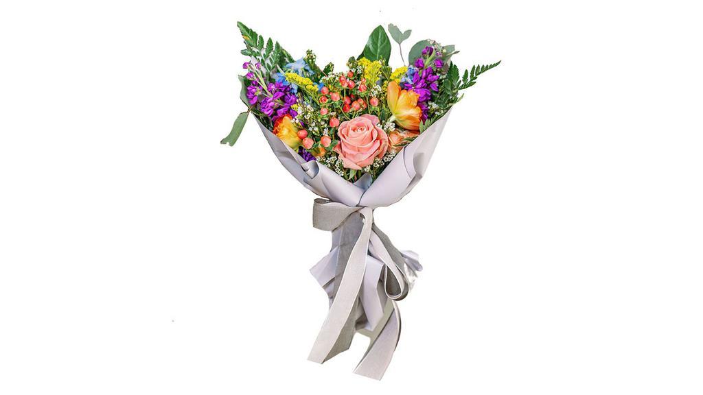 Designer'S Choice - Hand-Wrapped Bouquet · Designed in house with love, our hand-wrapped bouquet is a one-sided, wrapped bouquet that comes with 12 stems of seasonal blooms and bits wrapped in a layer of fun foliage!

Each arrangement in this style is handcrafted and one-of-a-kind, using the freshest flowers available

Please note: Flower type, design, and color will vary from the photo shown. Each arrangement is uniquely created by one of our artist