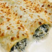 Spinach Manicotti · Pasta tubes stuffed with a mixture of spinach, Mozzarella, ricotta, and Parmesan cheese smot...