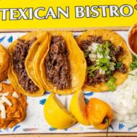 Taco Plate · Three tacos with your favorite meat and tortilla. Served with rice and beans.