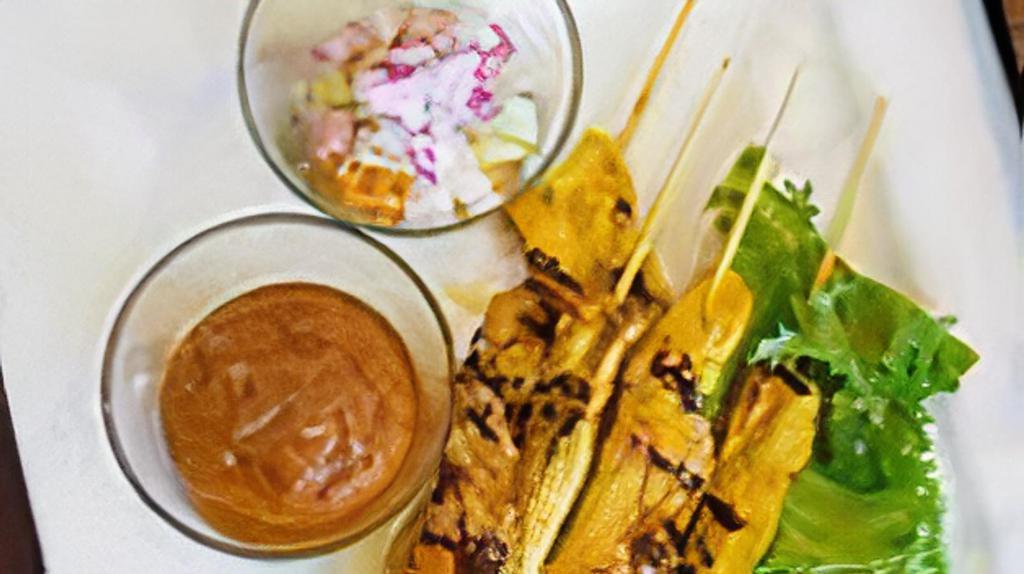 Chicken Satay (4) · Popular Appetizer! 
Grilled marinated chicken breast in a skewer served with peanut sauce and cucumber sauce.
