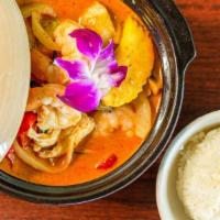 Panang Curry · Rich creamy Panang Curry with coconut milk, red and green bell peppers, green beans, and bas...