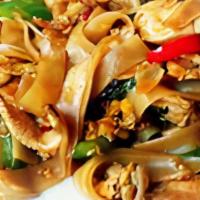 Drunken Noodles · Stir fried wide rice noodles with zucchini, mushroom, bell pepper, green beans, basil cooked...