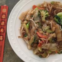 Pad Woon Sen · Stir-fried clear, crystal noodles with mixed vegetables, onions, and brown Thai sauce.