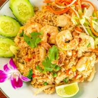 Thai Fried Rice · Fried rice, white onions, carrots, broccoli, stirred with house sauce topped with green onio...
