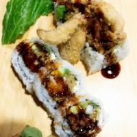 Spider Roll · Non-raw sushi. Inside out with deep-fried soft shell crab, avocado and masago topped with ka...