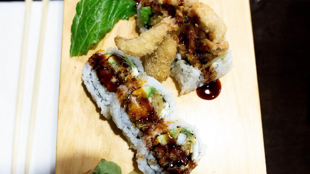 Spider Roll · Non-raw sushi. Inside out with deep-fried soft shell crab, avocado and masago topped with kabayaki sauce.