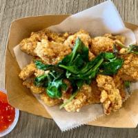 Popcorn Chicken · Fried popcorn chicken with basil leaves, comes with Sweet Chili sauce on the side