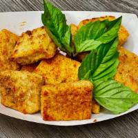 Organic Fry Tofu · Crunchy organic Fried Tofu with seasoning and basil leaves, comes with sweet chili sauce