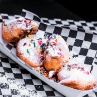 Classic Fried Oreos · Topped with powdered sugar and sprinkles.