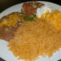 Enchiladas Beef · Topped with a creamy soup cream sauce, with refried beans, rice and salsa.