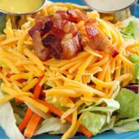 Small House Salad · Our salad mix (iceberg lettuce, carrots, red cabbage, and romaine lettuce) topped with herbe...