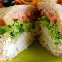 Turkey Breast · Sliced turkey breast, cranberry mayo, lettuce, and tomato, whole wheat bread. Served with ho...