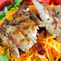 House Salad With Grilled Chicken · Our salad mix (iceberg lettuce, carrots, red cabbage, and romaine lettuce) topped with herbe...