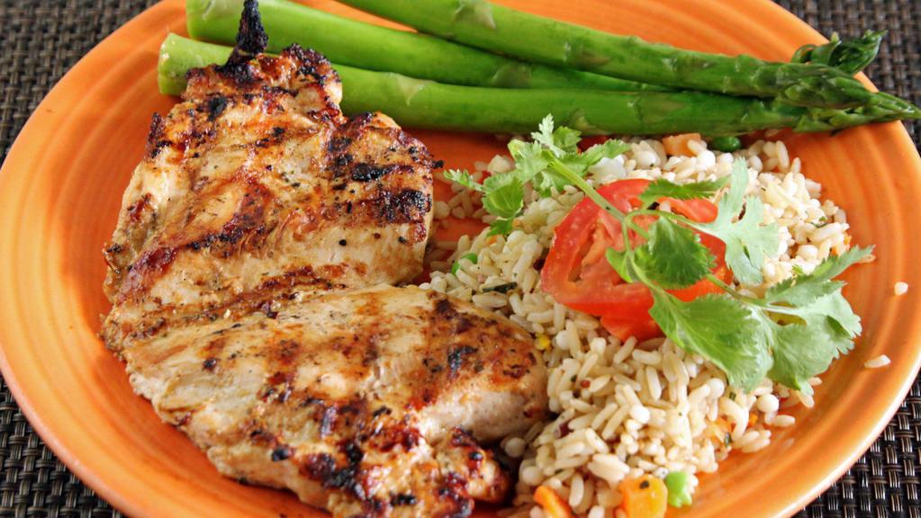 Grilled Chicken Breast · 10oz boneless, skinless, grilled chicken breast served with hearty grain rice and the vegetable of the day.