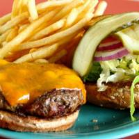 All Natural Cheeseburger · Topped with cheddar cheese, served open-faced with mayo, lettuce, tomato, onion, and pickle.