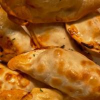 Gyoza (7 Pieces) · a Japanese dish consisting of wonton wrappers stuffed with pork and cabbage.