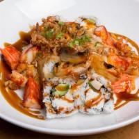 Volcano Roll · Baked. California Roll topped with Baked Crawfish or Scallop , Mushroom, Onion, Crunch Onion...