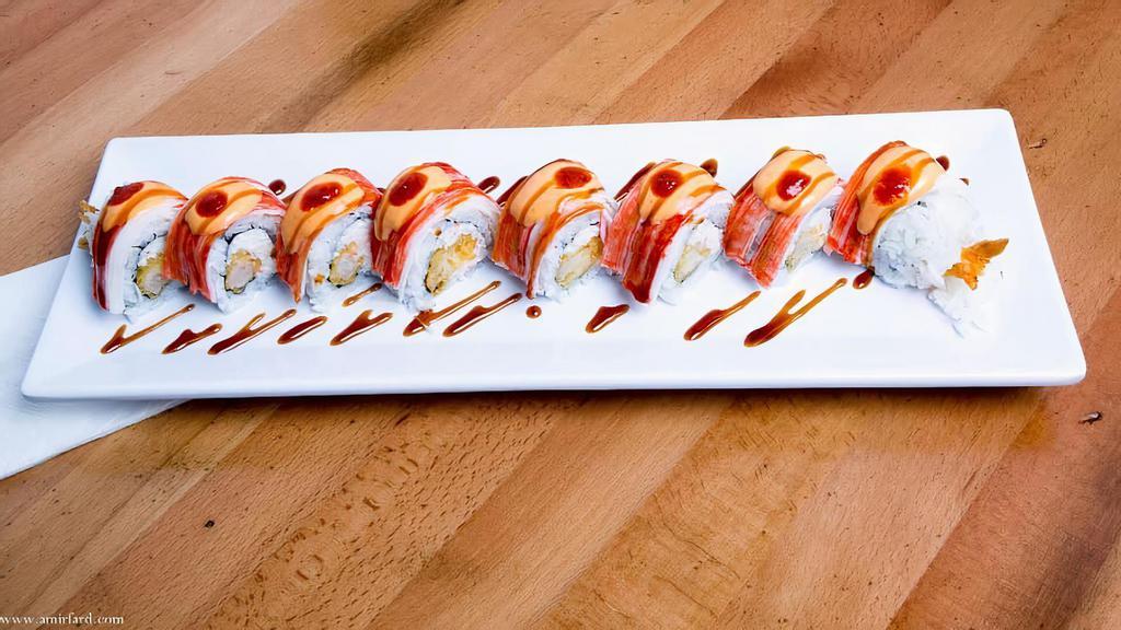 Sunset Roll · Shrimp Tempura, Crabmeat, Cucumber, Topped With Crabstick (Eel Sauce, Spicy Mayo, Sriracha)

Consuming raw or undercooked meats, poultry, seafood, shellfish, or eggs may increase your risk of food of foodborne illness.
