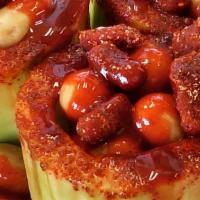 Pepino Loco · Cucumber filled with chamoy, tamarind candy, Japanese peanuts covered with chile powdered, l...