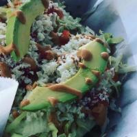 Empanada · Two empanadas stuffed with  chicken, topped with lettuce, tomatoes, avocado, queso fresco an...