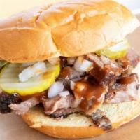 Texas O.G · The classic Texas BBQ sandwich. Prime angus brisket topped with pickles, onions and backyard...