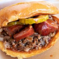 Brisket Texas Two Step · Topped with sausage, pickles, onions and your choice of backyard red, gold rush, dank white ...