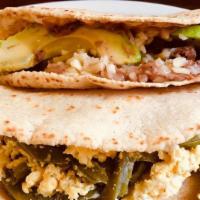 Taco Norteño · Homemade flour tortilla, beans, meat of your choice, avocado and melted cheese.