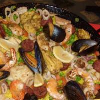 Paella Valenciana (For 2 Ppl) · Gluten free. Spanish saffron rice, calamari, sausage, chicken, fish, mussels and shrimp